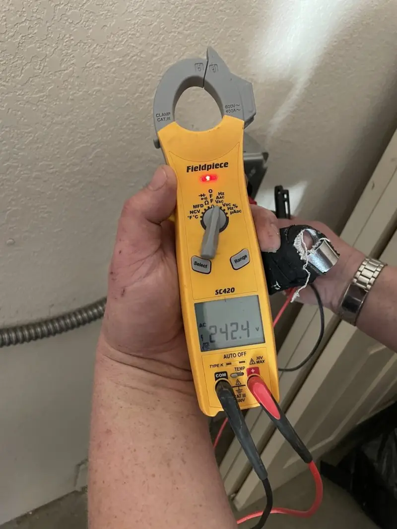 Voltage testing with clamp meter during Ceiling Fan Installation in Guilderland